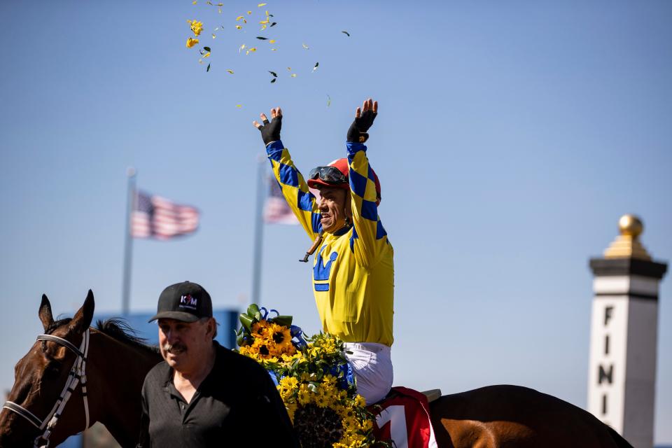 Jockey Alfredo J. Juarez, Jr. celebrates by throwing flowers up in the air after riding Flying Connection (1) to the win in the Sunland Oaks during the 18th running of the Sunland Derby at Sunland Park Racetrack & Casino in Sunland Park , New Mexico , Sunday, March 26, 2023. The trainer is Todd Fincher. 