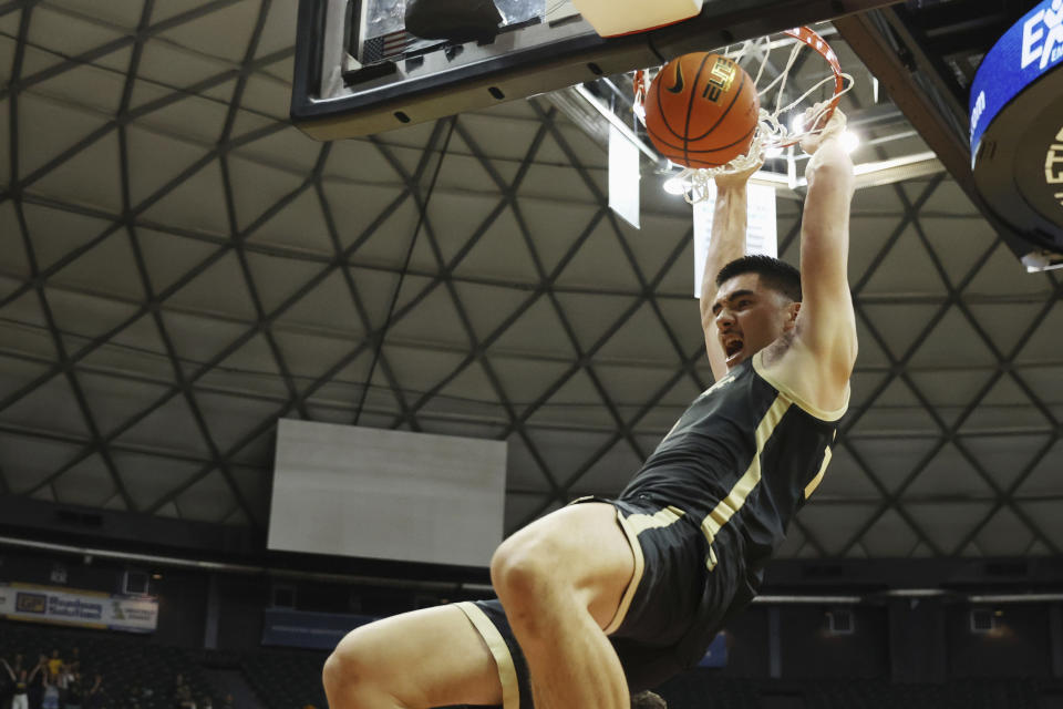 Purdue center Zach Edey dunks against Marquette during the second half of an NCAA college basketball game Wednesday, Nov. 22, 2023, in Honolulu. (AP Photo/Marco Garcia)