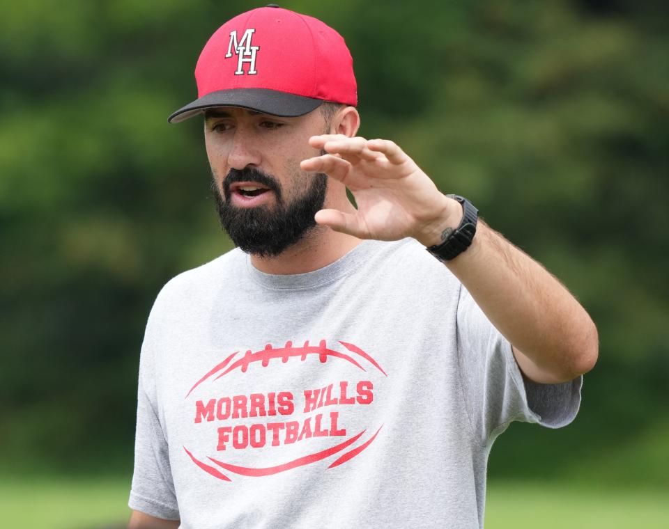 Morris Hills coach Bruce Campbell getting his team ready for the 2023 season during a summer football practice at Morris Hills HS.