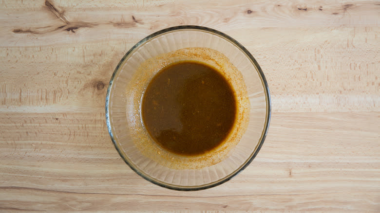 brown marinade in clear bowl