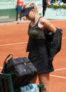 Russia's Maria Sharapova takes off her jacket prior to Women's Single final tennis match against Italy's Sara Errani at the French Open tennis tournament at the Roland Garros stadium, on June 9, 2012 in Paris. AFP PHOTO / PATRICK KOVARIKPATRICK KOVARIK/AFP/GettyImages