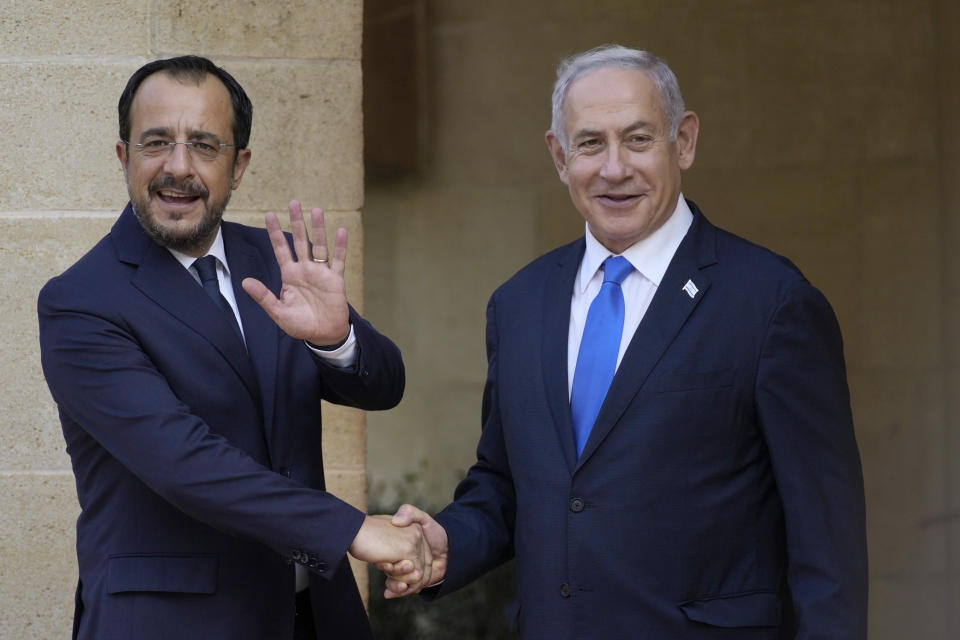 Cypriot president Nikos Christodoulides, left, and Israeli Prime Minister Benjamin Netanyahu shake hands before their meeting at the presidential palace in capital Nicosia, Cyprus, on Sunday, Sept. 3, 2023. An official statement said Christodoulides and Netanyahu will touch on expanding energy cooperation and bilateral ties, as well as Israel's relations with the European Union. The leaders' meeting comes a day ahead of a trilateral meeting that will include Greek Prime Minister Kyriakos Mitsotakis. (AP Photo/Petros Karadjias)