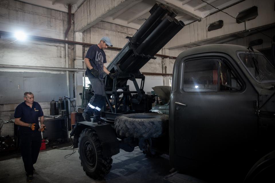 Ukrainian civilian volunteers work to modify damaged and salvaged vehicles into small mobile MLRS (Multiple Launch Rocket System) units made from recovered Russian and Ukrainian military hardware on September 25, 2023, in Zaporizhzhia, Ukraine.