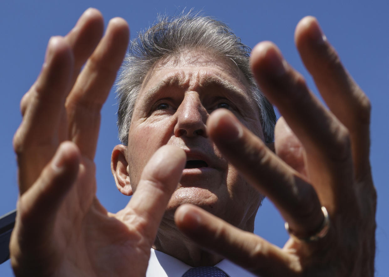 Sen. Joe Manchin, D-W.Va., a centrist Democrat vital to the fate of President Joe Biden's $3.5 government overhaul, updates reporters about his position on the bill, at the Capitol in Washington, Thursday, Sept. 30, 2021. Despite months of being courted and cajoled, Sen. Joe Manchin is still not a yes on President Joe Biden's big $2 trillion domestic package and has thrown Democrats into turmoil. (AP Photo/J. Scott Applewhite, File)