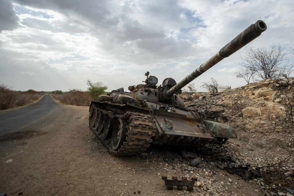 A destroyed tank is seen by the side of the road south of Humera, in an area of western Tigray annexed by the Amhara region during the ongoing conflict, in Ethiopia Saturday, May 1, 2021. Ethiopia faces a growing crisis of ethnic nationalism that some fear could tear Africa's second most populous country apart, six months after the government launched a military operation in the Tigray region to capture its fugitive leaders. (AP Photo/Ben Curtis)