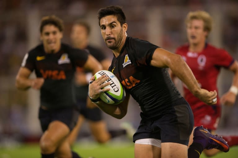 Jaguares centre Jeronimo De la Fuente (C) runs in a try against Queensland Reds during a bruising Super Rugby clash at Jose Amalfitani stadium in Buenos Aires