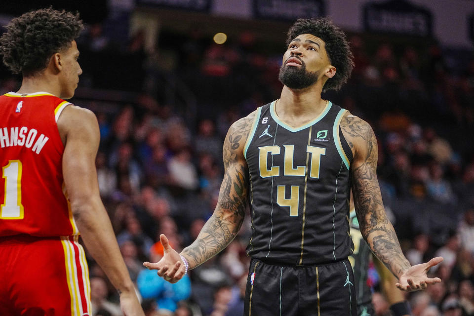 Charlotte Hornets center Nick Richards (4) questions a missed shot during the first half of an NBA basketball game against the Atlanta Hawks, Friday, Dec. 16, 2022, in Charlotte, N.C. (AP Photo/Rusty Jones)