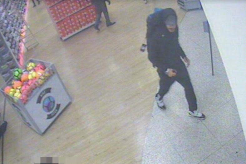 CCTV image of Salman Abedi at Sports Direct where he bought the suitcase used to transport the bomb (PA)