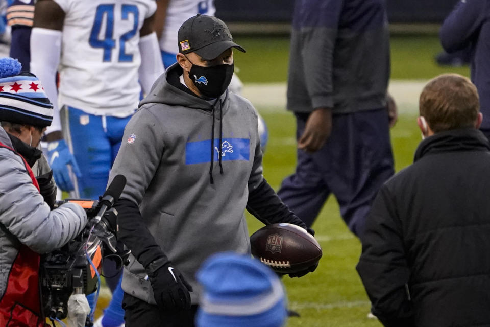Detroit Lions head coach Darrell Bevell carries a game ball as he leaves the field following a 34-30 win over the Chicago Bears in an NFL football game in Chicago, Sunday, Dec. 6, 2020. (AP Photo/Charles Rex Arbogast)