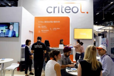 Members of staff work at the Criteo booth during Global Mobile Internet Conference (GMIC) at the National Convention in Beijing, China April 27, 2018. REUTERS/Damir Sagolj