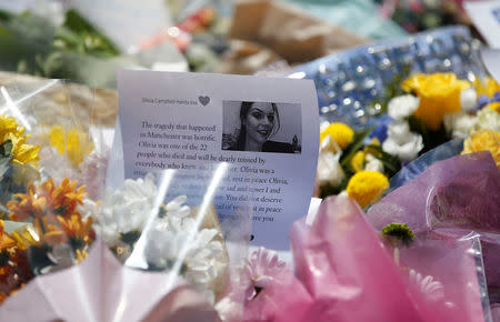 Flowers are left outside Tottington high school, in memory of pupil Olivia Campbell who was killed during the Manchester Arena attack, Bury, Manchester, Britain, May 26, 2017. REUTERS/Andrew Yates