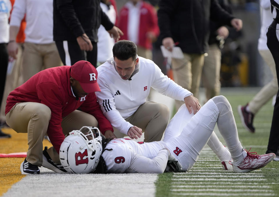 Members of the Rutgers staff tend to wide receiver JaQuae Jackson (9) during the first half of an NCAA college football game against Iowa, Saturday, Nov. 11, 2023, in Iowa City, Iowa. (AP Photo/Bryon Houlgrave)