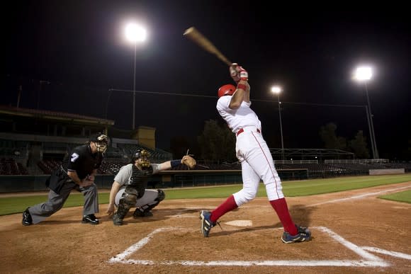 Baseball player swinging bat