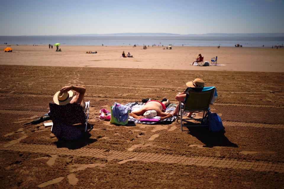 People on the beach at Barry Island, Wales, enjoying the hot weather.