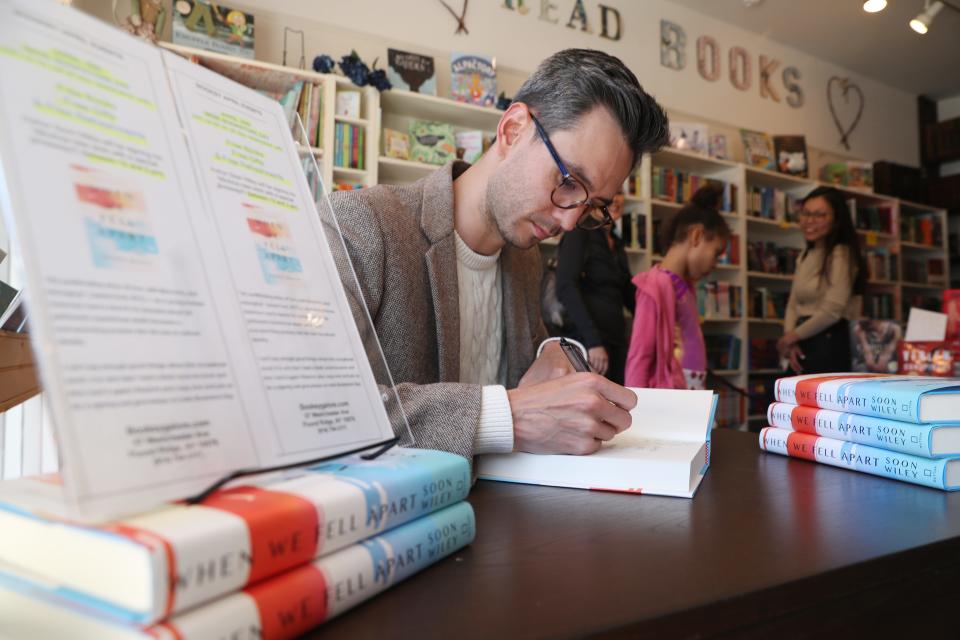 Nyack native Soon Wiley signs a copy of his debut novel "When We Fell Apart" at Booksy Galore in Pound Ridge April 30, 2022. The book is getting over-the-top buzz in the publishing world.