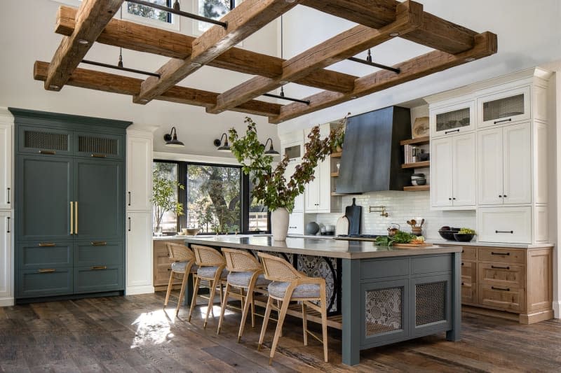 Farmhouse style kitchen with large statement wood light fixture