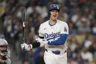 Los Angeles Dodgers designated hitter Shohei Ohtani (17) reacts after hitting a foul ball during the third inning of a baseball game against the Cincinnati Reds in Los Angeles, Thursday, May 16, 2024. (AP Photo/Ashley Landis)