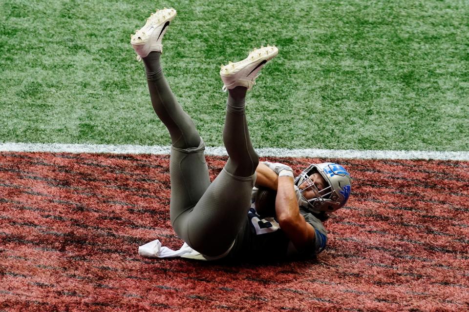 Lions tight end T.J. Hockenson falls into the end zone for a touchdown against the Falcons during the second half of the Lions' 23-22 win on Sunday, Oct. 25, 2020, in Atlanta.