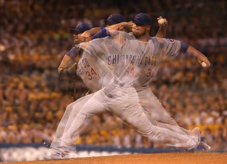 Sep 15, 2015; Pittsburgh, PA, USA; (Editors note: Multiple exposure image) Chicago Cubs starting pitcher Jon Lester (34) pitches against the Pittsburgh Pirates during the sixth inning at PNC Park. Mandatory Credit: Charles LeClaire-USA TODAY Sports