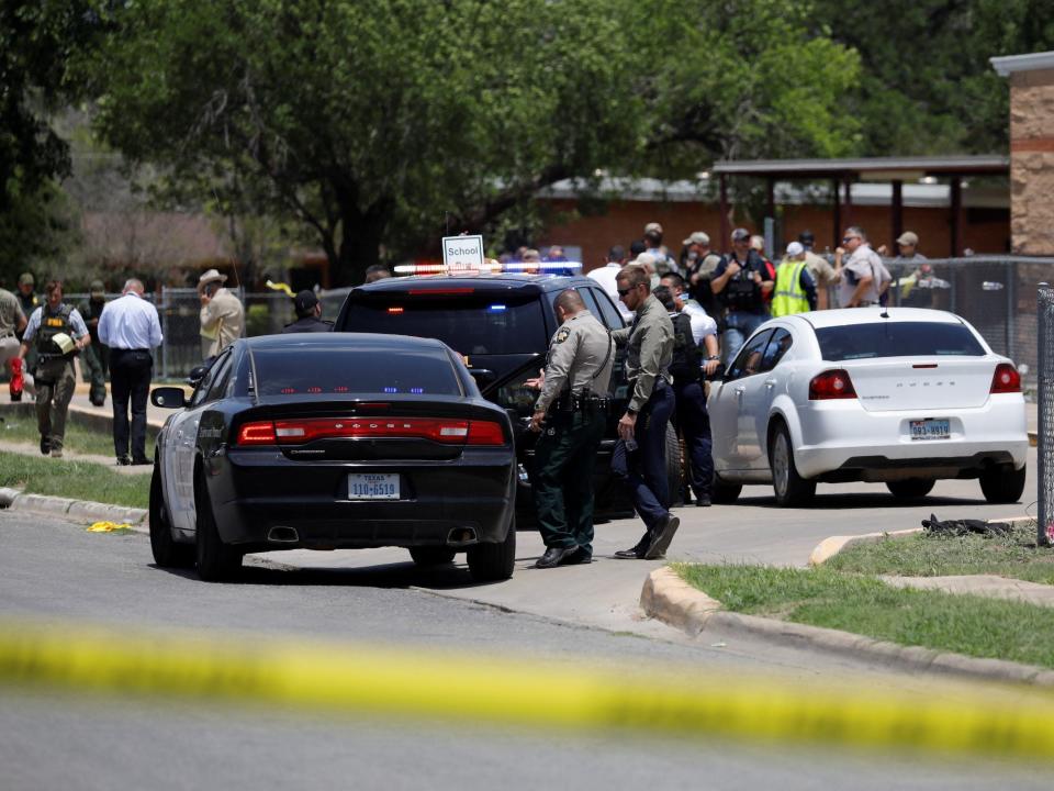 Law enforcement officers guard the scene of a shooting at Robb Elementary School in Uvalde, Texas, U.S. May 24, 2022. REUTERS/Marco Bello