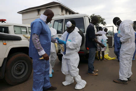 Emergency workers are pictured at the central morgue at Connaught Hospital in Freetown, Sierra Leone August 16, 2017. REUTERS/Afolabi Sotunde