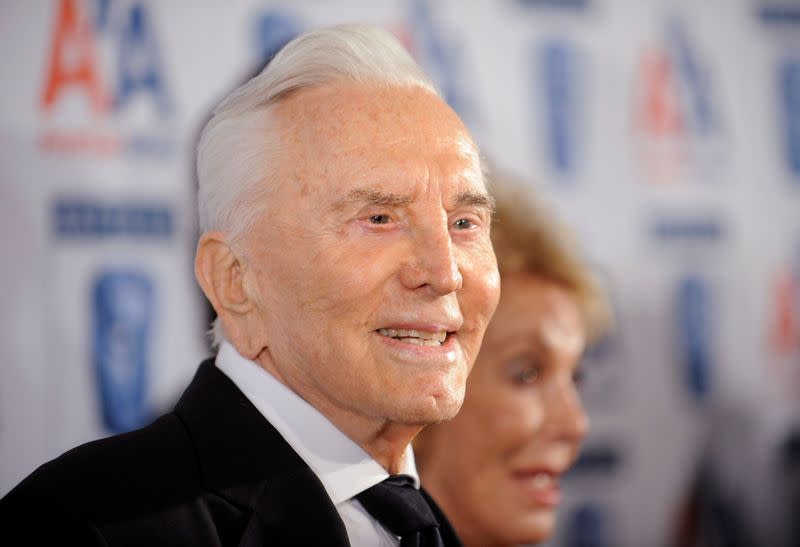 FILE PHOTO: Honoree Kirk Douglas (L) attends the 18th annual BAFTA/LA Britannia Awards in Los Angeles, California