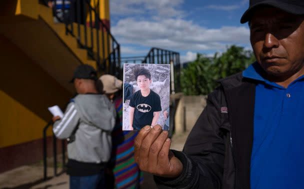 PHOTO: A man holds a portrait of Wilmer Tulul, in Tzucubal, Guatemala, June 29, 2022.  (Moises Castillo/AP)