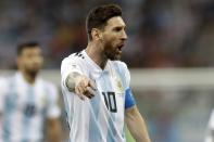 <p>Feeling the pich?: Messi talks to his Argentine teammates. (AP) </p>