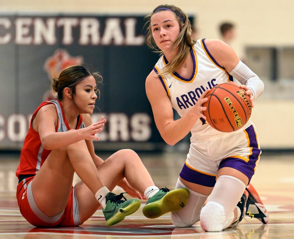 Watertown's Jaida Young (12) comes up with the loose ball in front of Rapid City Central's Aaliyah Jones (11) during a game on Saturday, Jan. 21, 2023 in Naasz Gymnasium.