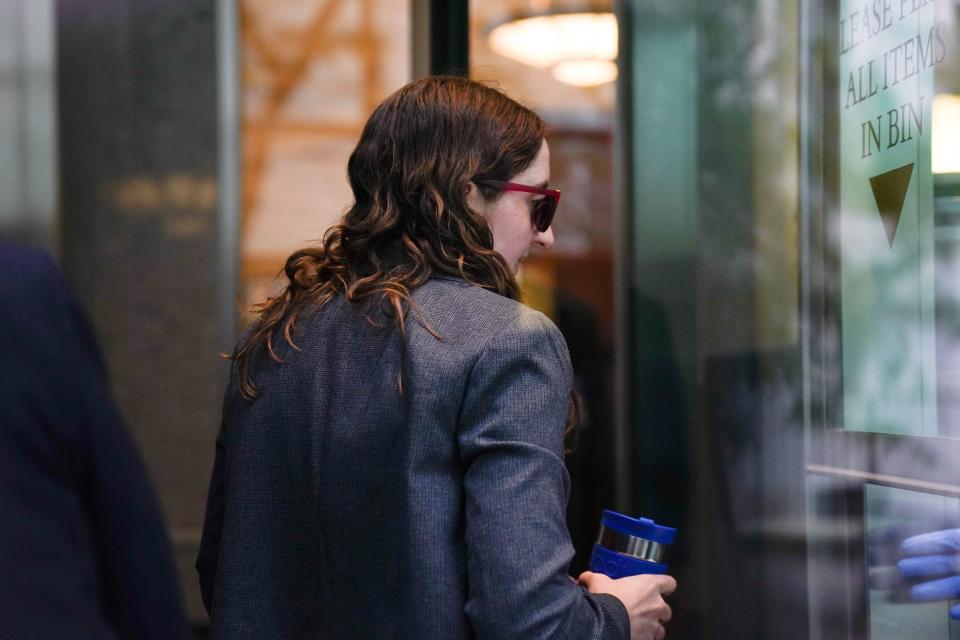 Sam Bankman-Fried's former girlfriend, Caroline Ellison, walks through security at Manhattan Federal Court.