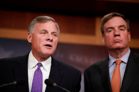 Sen. Richard Burr (R-NC), accompanied by Sen. Mark Warner (D-VA), gives an update on the ongoing investigation into Russian involvement in the 2016 election at the Capitol Building in Washington, U.S., October 4, 2017. REUTERS/Aaron P. Bernstein