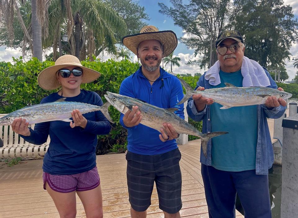 Homosassa residents Sandra Gutierrez, left, Miguel Gutierrez, center, and Roberto Tirado caught these 6 to 7-pound class Spanish mackerel on live scaled sardines while fishing in lower Tampa Bay with Capt. John Gunter on Tuesday.