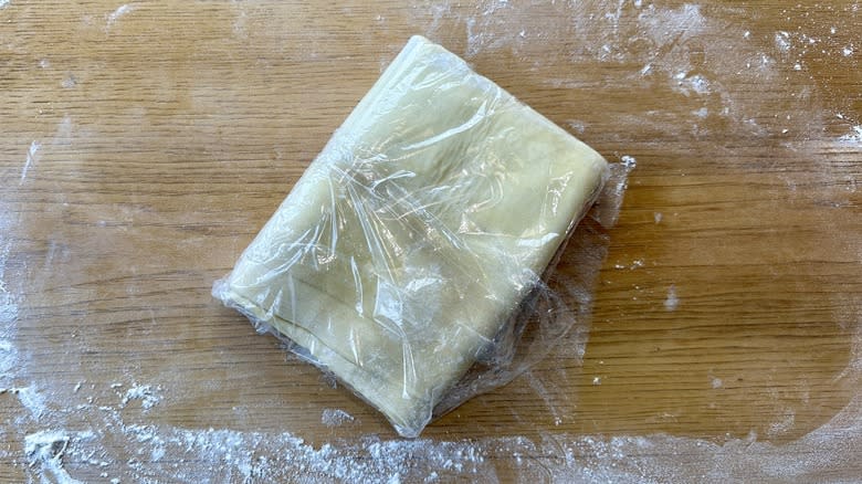 plastic wrapped dough square