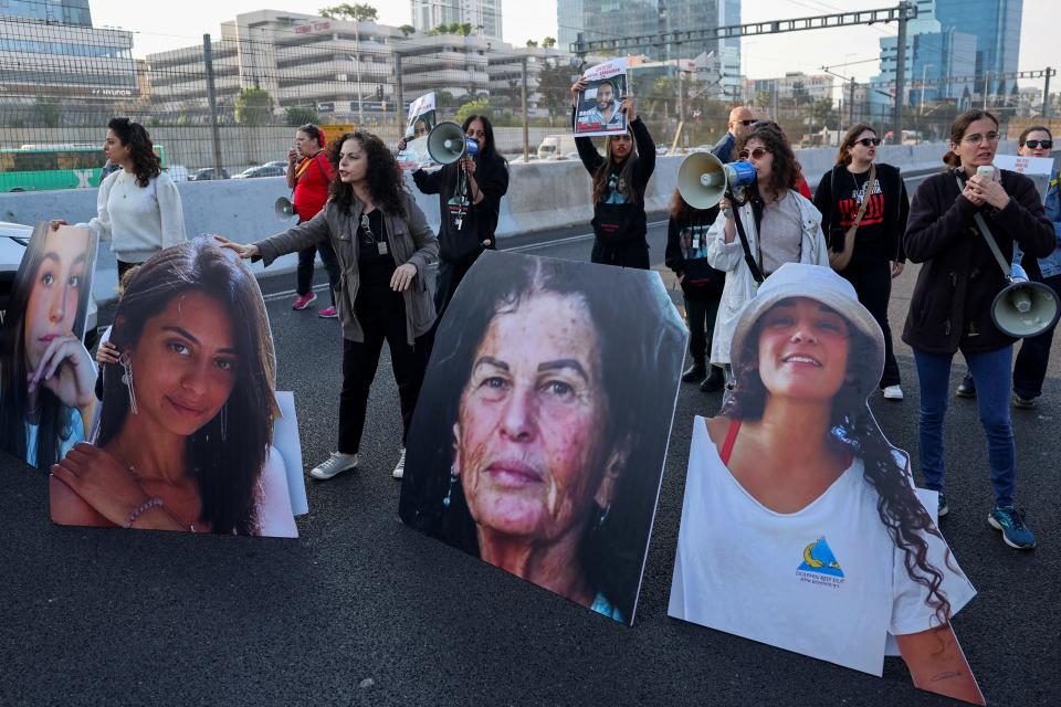 Activists and families of Israeli hostages held in Gaza by Hamas block a highway in Tel Aviv on March 14, 2024, during a protest calling for their release.