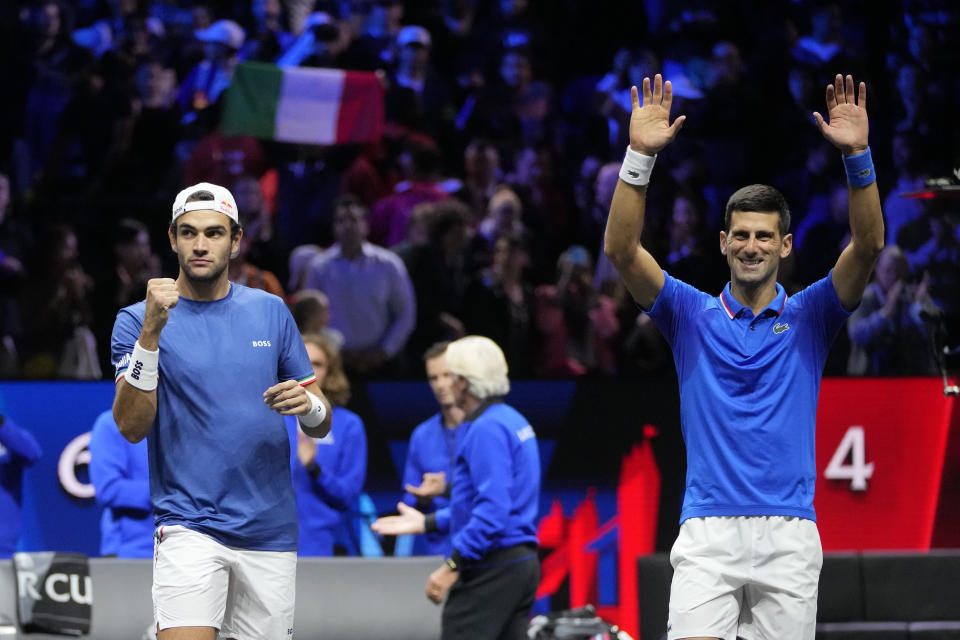 Team Europe's Novak Djokovic and Matteo Berrettini celebrate after winning a match against Team World's Jack Sock and Alex de Minaur on second day of the Laver Cup tennis tournament at the O2 in London, Saturday, Sept. 24, 2022. (AP Photo/Kin Cheung)