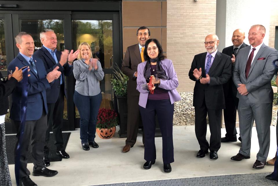 There are smiles all around as Indus Hospitality Group and Hornell officials take part in a ribbon cutting for new the Hampton Inn by Hilton Hornell on Oct. 11, 2023.