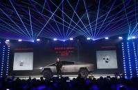 Tesla CEO Elon Musk introduces the Cybertruck at Tesla's design studio Thursday, Nov. 21, 2019, in Hawthorne, Calif. (AP Photo/Ringo H.W. Chiu)