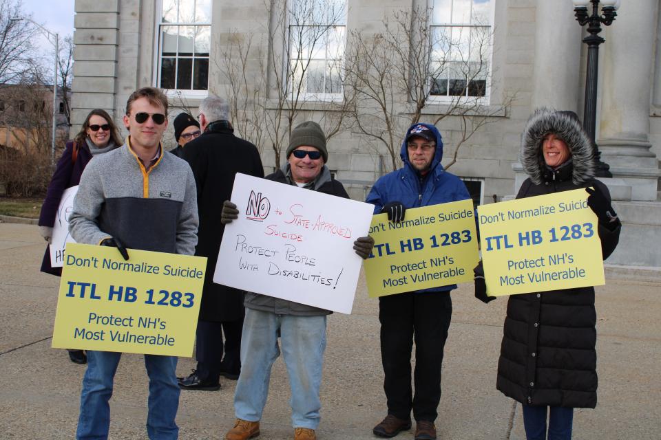 Opponents of the End of Life Options act gather in front of the Statehouse Thursday, March 21.