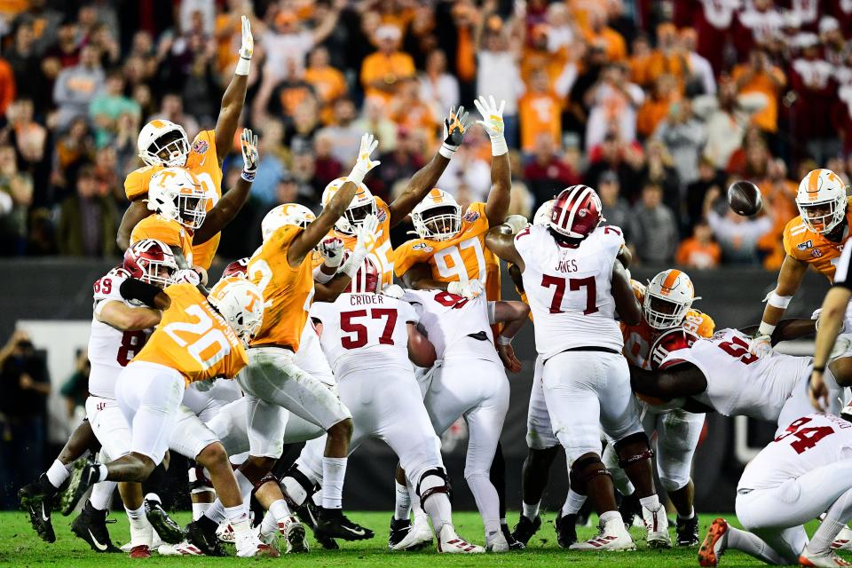 Tennessee players defend against a field goal attempt by Indiana in the fourth quarter during the Gator Bowl game between Tennessee and Indiana at TIAA Bank Field in Jacksonville, Fla. on Thursday, Jan. 2, 2020.