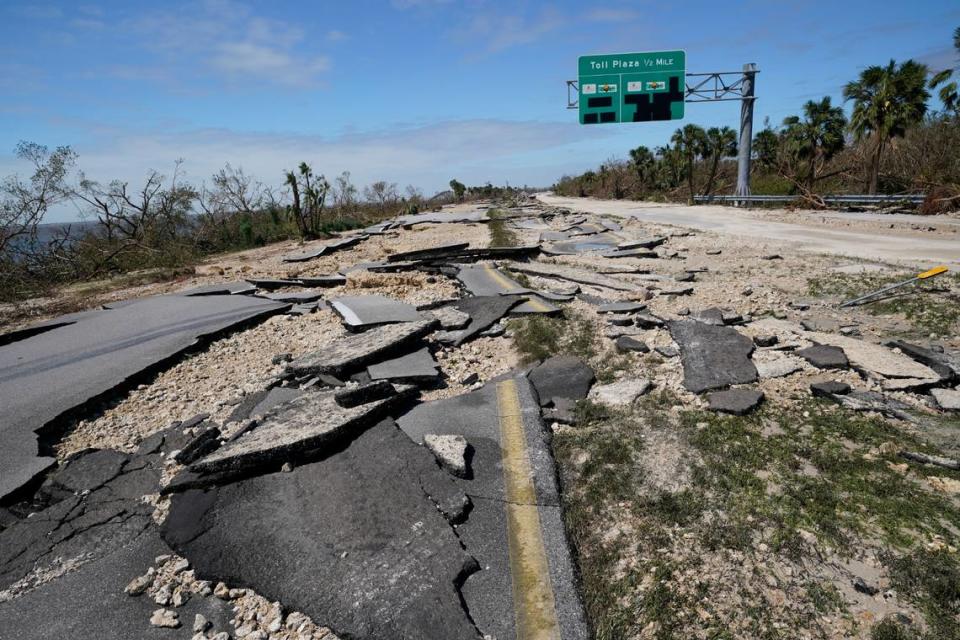 Broken pavement lies flat leading to the Sanibel Island causeway in the aftermath of Hurricane Ian, Thursday, Sept. 29, 2022, in Fort Myers, Fla.