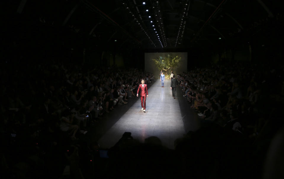 Models wear creations of the Dolce & Gabbana men's Spring-Summer 2014 collection, part of the Milan Fashion Week, unveiled in Milan, Italy, Saturday, June 22, 2013. (AP Photo/Luca Bruno)