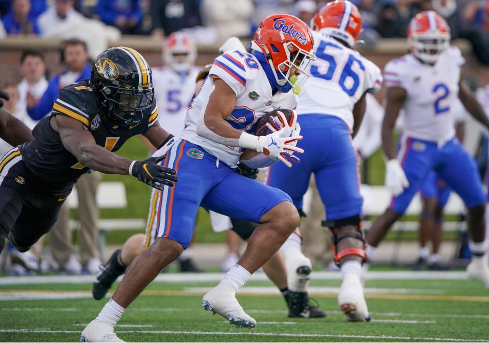 Florida running back Malik Davis (20) runs the ball as Missouri defensive back Jaylon Carlies (1) defends during a game last season at Faurot Field.