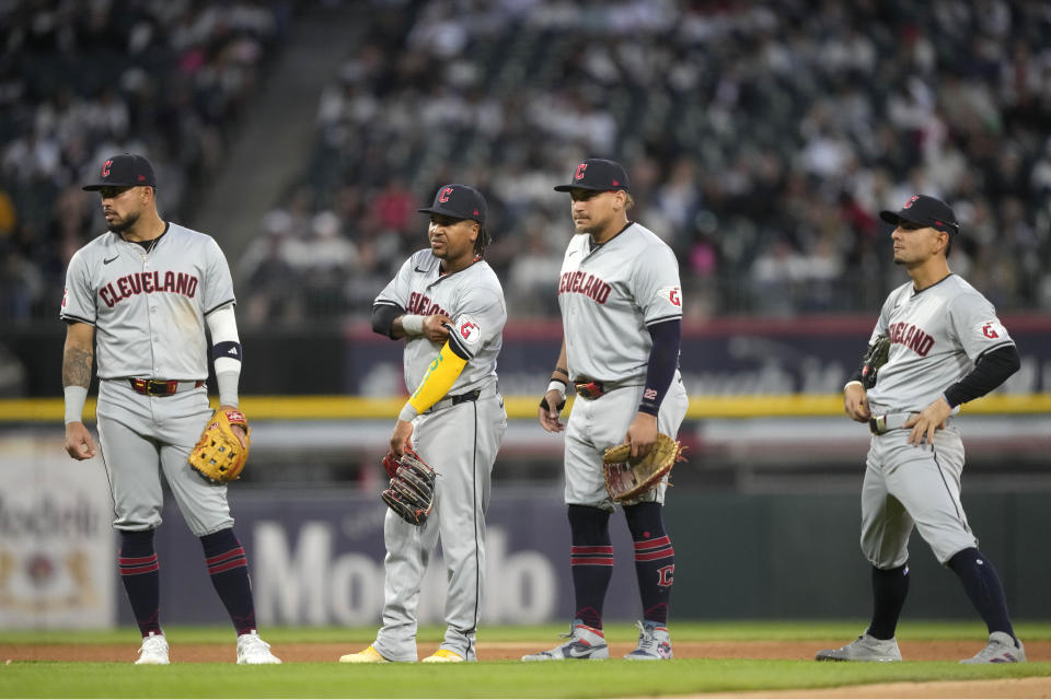 From left to right, Cleveland Guardians infielders Gabriel Arias, José Ramírez, Josh Naylor and Andrés Giménez, waits for a pitching change in the seventh inning of a baseball game against the Chicago White Sox, Saturday, May 11, 2024, in Chicago. (AP Photo/Charles Rex Arbogast)