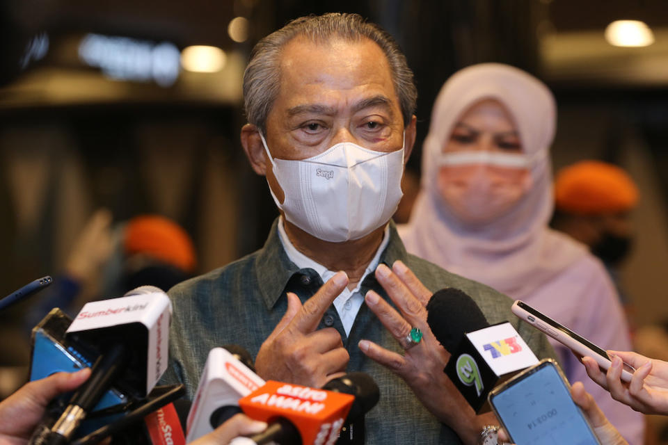 Prime Minister Tan Sri Muhyiddin Yassin speaks to members of the media during his visit to the vaccination centre at Sunway Pyramid Convention Centre in Petaling Jaya June 27, 2021. — Picture by Yusof Mat Isa