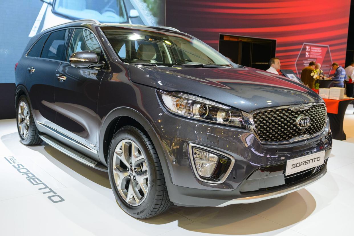 Brussels, Belgium - January 15, 2015: Kia Sorento crossover SUV on display during the 2015 Brussels motor show. People in the background are looking at the cars.
