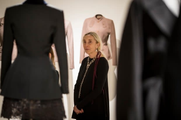 Carla Sozzani admires Alaïa's designs, with Adrian's behind her, at the opening reception of 'Alaïa-Adrian: Masters of Cut' at the SCAD FASH Museum of Fashion + Film in Atlanta.