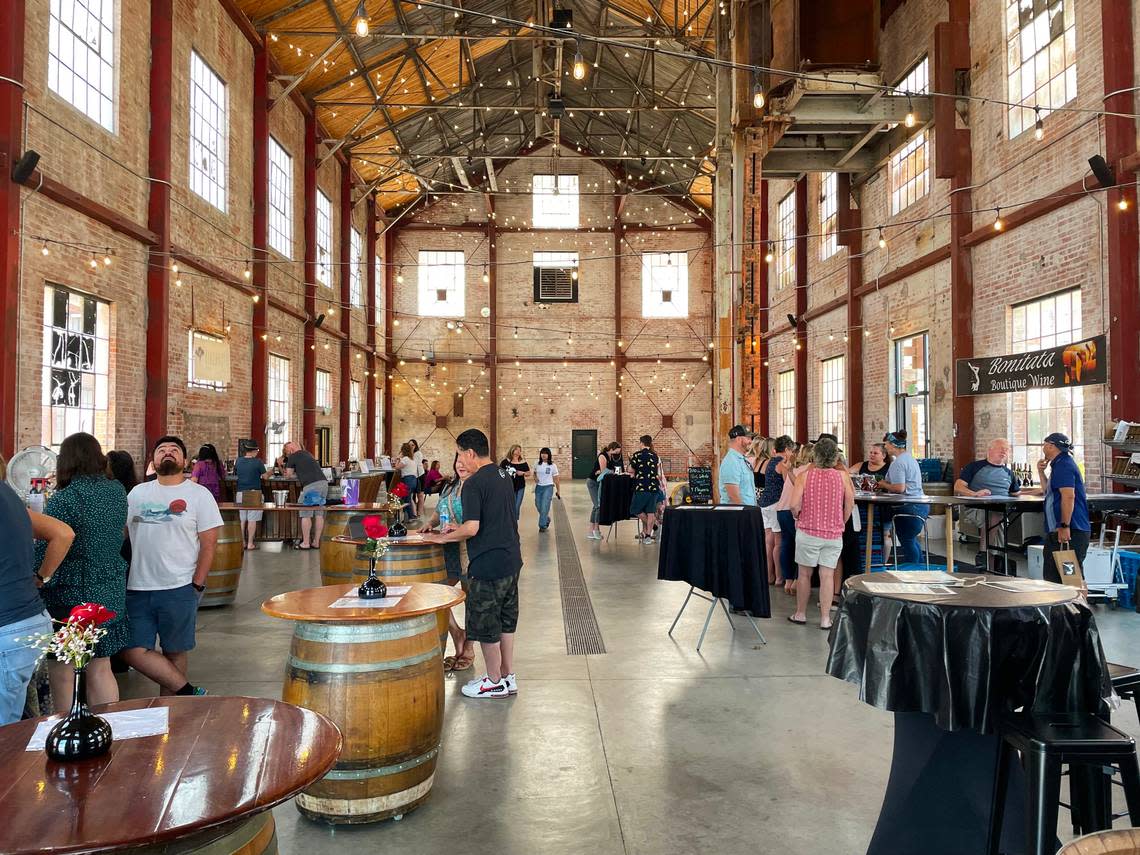 Customers taste wines in the boiler room at the Old Sugar Mill in Clarksburg in June.
