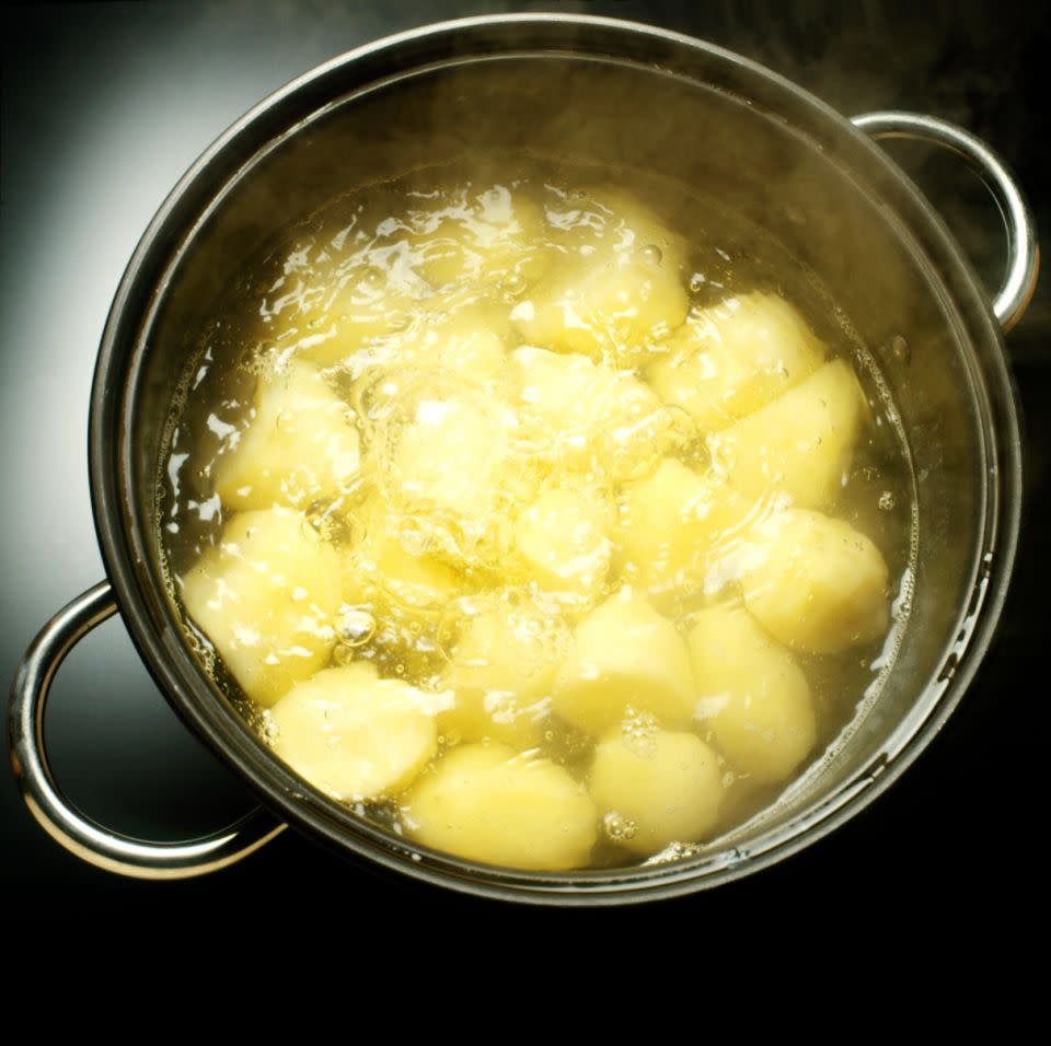 Parboil your potatoes for at least 20 minutes. Photo: Getty