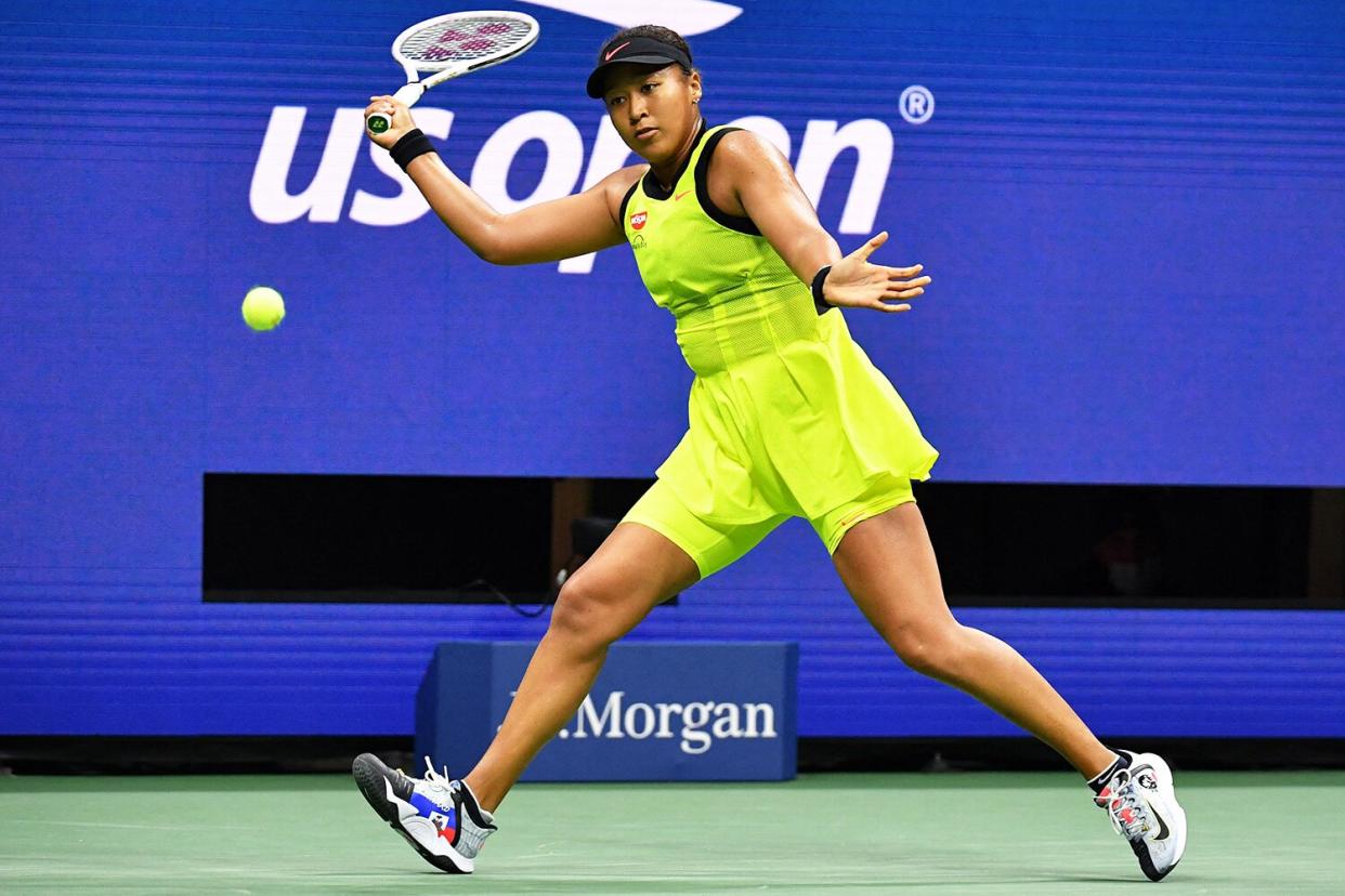 Japan's Naomi Osaka hits a return to Canada's Leylah Fernandez during their 2021 US Open Tennis tournament women's singles third round match at the USTA Billie Jean King National Tennis Center in New York, on September 3, 2021.