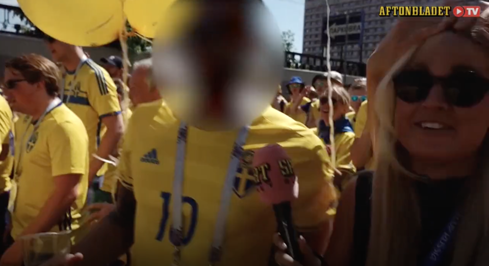 Swedish reporter Malin Wahlberg attempting to interact with Swedish fans at the 2018 World Cup.